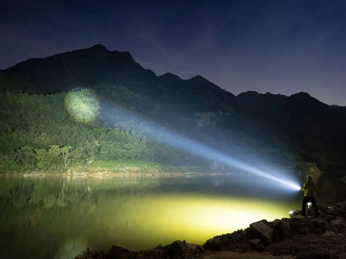 Olight Marauder Mini 2 Mountain Beam Olight Marauder Mini 2 projecting spotlight and floodlight beams across a mountain lake at night