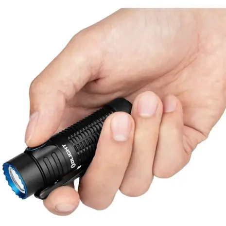 Olight Warrior Nano Rechargeable LED Flashlight - compact black flashlight held in a hand Olight Warrior Nano Rechargeable LED Flashlight - compact black flashlight held in a hand