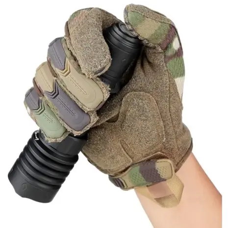 Olight Warrior X 4 Rechargeable LED 2600 Lumen Flashlight - camouflage-gloved hand holding black flashlight at tail switch Olight Warrior X 4 Rechargeable LED 2600 Lumen Flashlight - camouflage-gloved hand holding black flashlight at tail switch