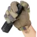 Olight Warrior X 4 Rechargeable LED 2600 Lumen Flashlight - camouflage-gloved hand holding black flashlight at tail switch