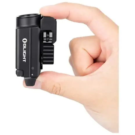 Olight Baldr S Weapon Light - black compact weapon light held between fingers Olight Baldr S Weapon Light - black compact weapon light held between fingers